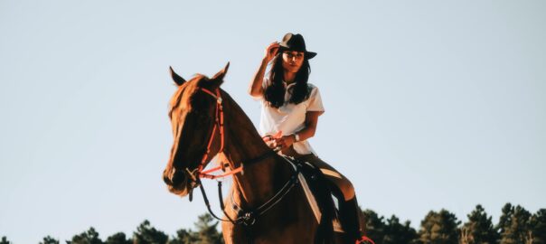 a woman riding a horse